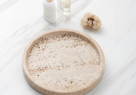 White marble round tray styled in a home setting, demonstrating how it elevates daily objects