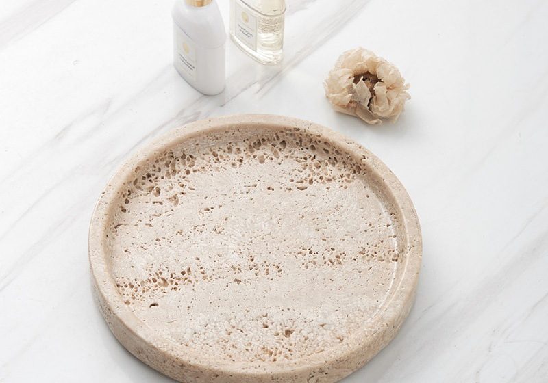 White marble round tray styled in a home setting, demonstrating how it elevates daily objects