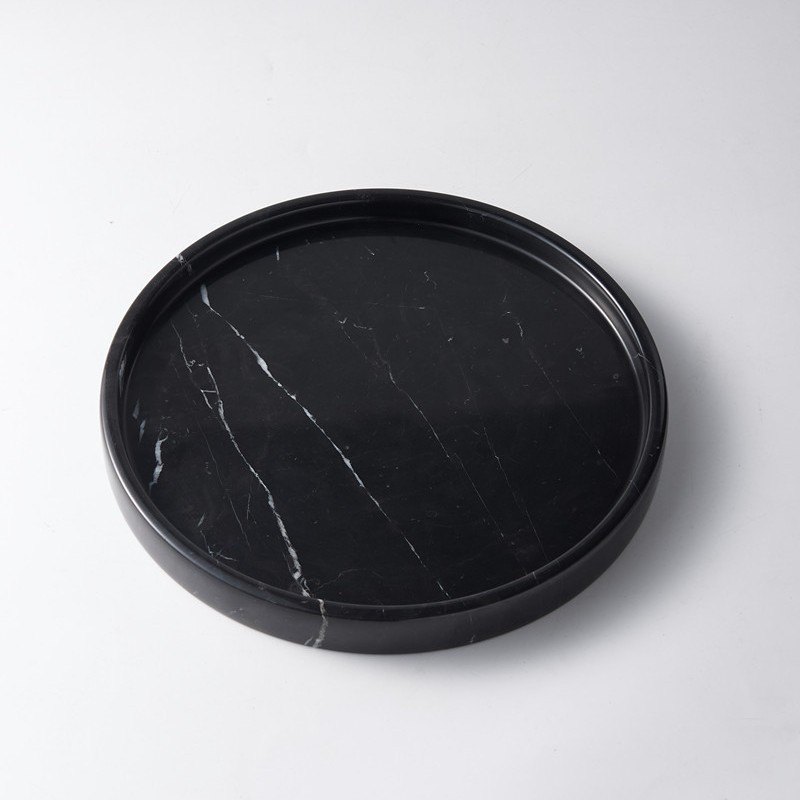 Dark marble round tray isolated on white background, clean product view